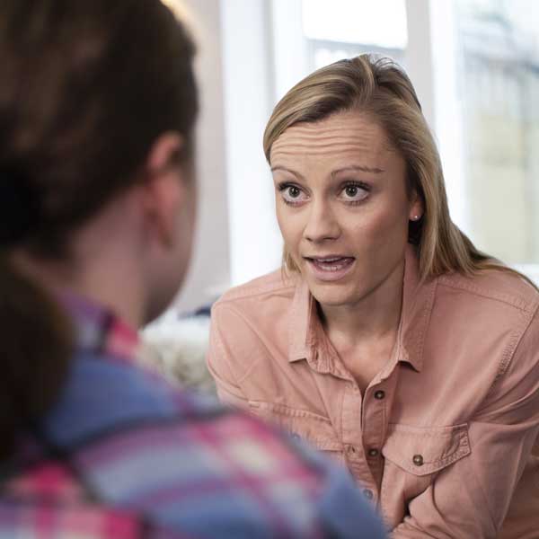 A counselor talking to a young person
